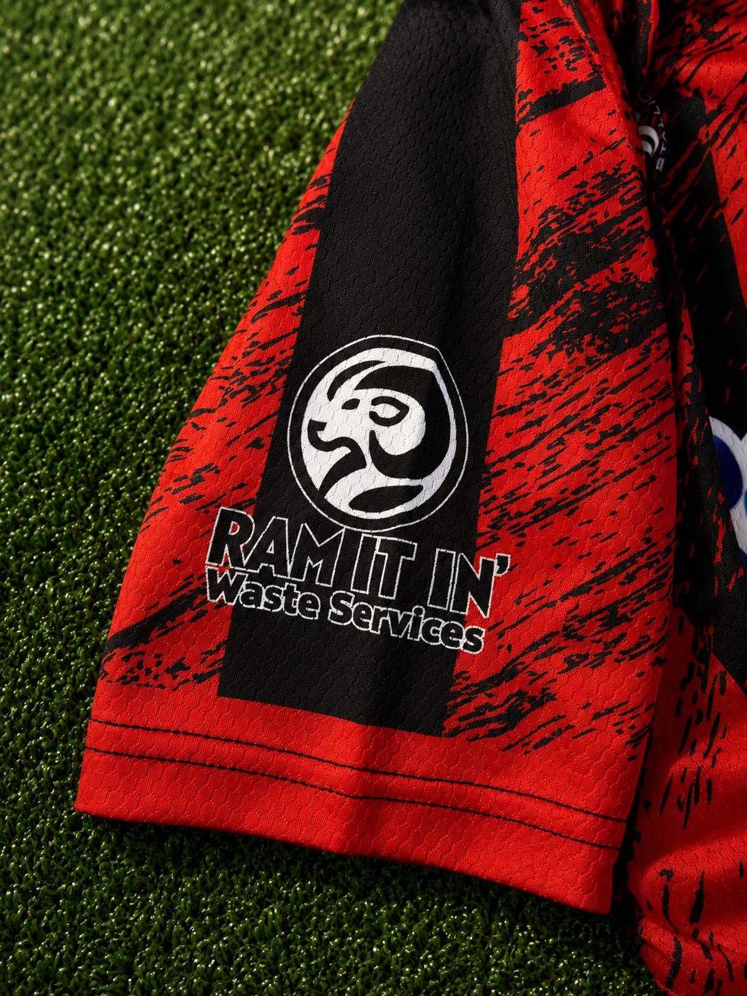 Ram It In Waste Services sleeve detail on Lilly Street Lions FC home kit